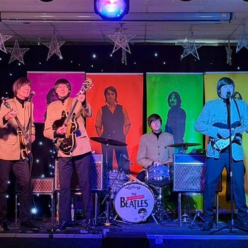 A photo of the Counterfeit Beatles performing 