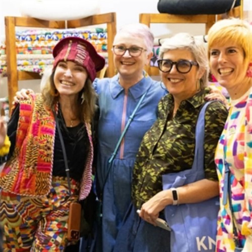 a photo of people at knit and stitch having there photo taken 