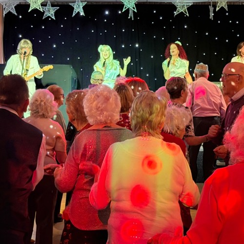 a photo of the performers and people dancing 